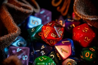 Close-up image of various colored role-playing gaming dice in a dice bag
